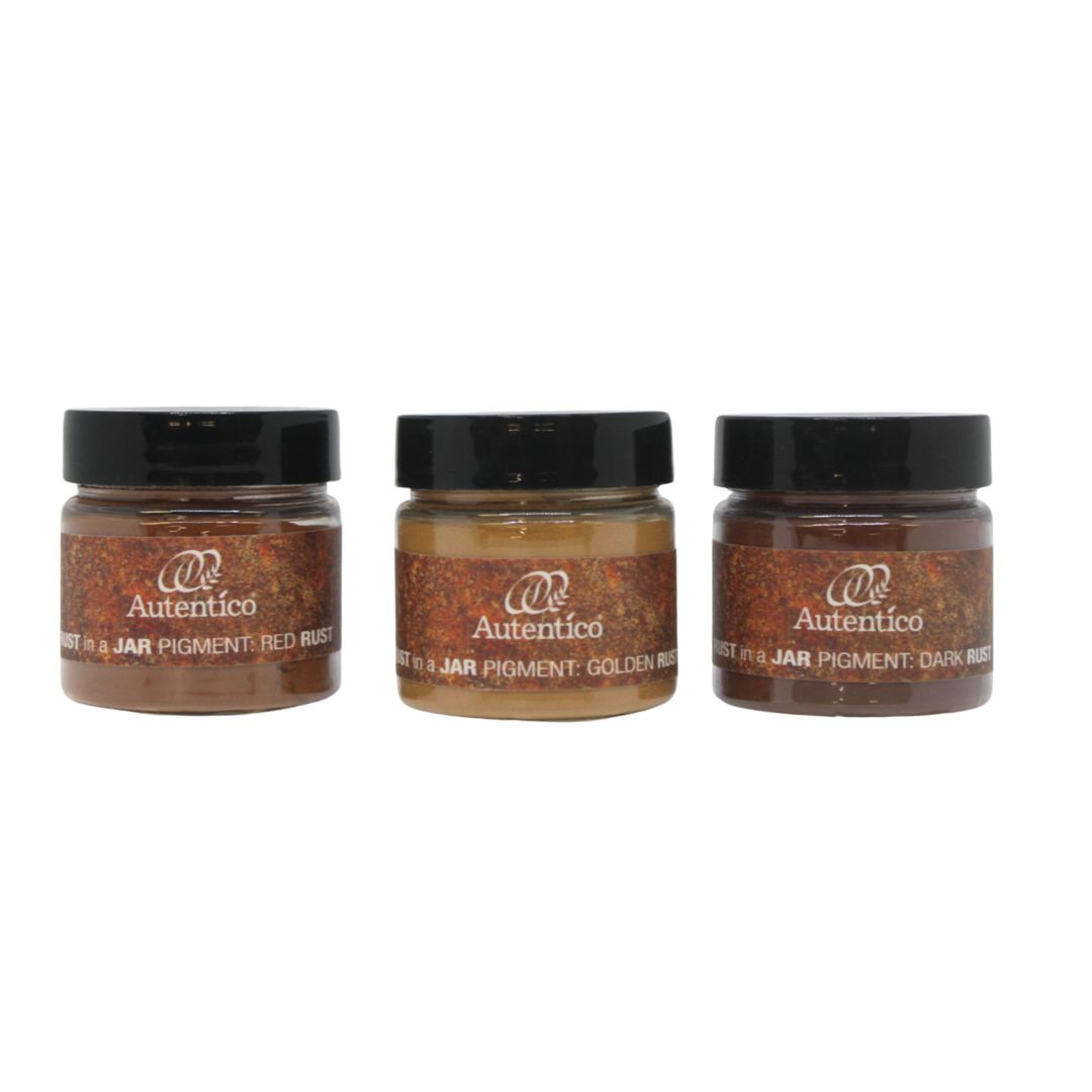 Three small jars of Autentico pigment powder arranged side by side on a plain white background. The jars are labeled Red Wash, Golden Wash, and Dark Rush.